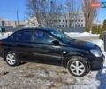 Черный Киа Рио, объемом двигателя 1.4 л и пробегом 259 тыс. км за 4500 $, фото 1 на Automoto.ua