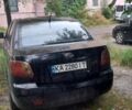 Чорний Кіа Ріо, об'ємом двигуна 1.4 л та пробігом 270 тис. км за 2198 $, фото 2 на Automoto.ua