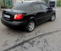 Черный Киа Рио, объемом двигателя 1.4 л и пробегом 85 тыс. км за 6000 $, фото 1 на Automoto.ua