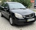 Черный Киа Рио, объемом двигателя 1.4 л и пробегом 155 тыс. км за 3900 $, фото 1 на Automoto.ua