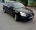 Черный Киа Рио, объемом двигателя 1.4 л и пробегом 85 тыс. км за 6000 $, фото 1 на Automoto.ua