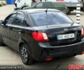 Чорний Кіа Ріо, об'ємом двигуна 1.4 л та пробігом 220 тис. км за 4700 $, фото 3 на Automoto.ua