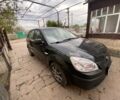 Черный Киа Рио, объемом двигателя 1.4 л и пробегом 250 тыс. км за 3399 $, фото 2 на Automoto.ua