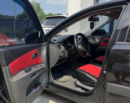 Чорний Кіа Ріо, об'ємом двигуна 1.5 л та пробігом 259 тис. км за 4388 $, фото 3 на Automoto.ua