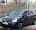 Чорний Кіа Ріо, об'ємом двигуна 1.4 л та пробігом 220 тис. км за 4700 $, фото 1 на Automoto.ua