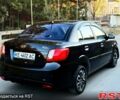Черный Киа Рио, объемом двигателя 1.4 л и пробегом 224 тыс. км за 4999 $, фото 1 на Automoto.ua