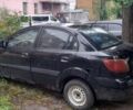 Чорний Кіа Ріо, об'ємом двигуна 1.4 л та пробігом 270 тис. км за 2198 $, фото 3 на Automoto.ua