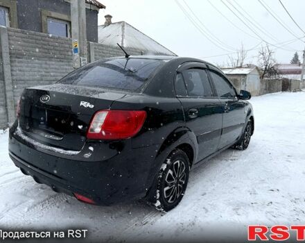 Чорний Кіа Ріо, об'ємом двигуна 1.4 л та пробігом 167 тис. км за 5550 $, фото 1 на Automoto.ua