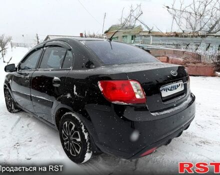 Чорний Кіа Ріо, об'ємом двигуна 1.4 л та пробігом 167 тис. км за 5550 $, фото 2 на Automoto.ua