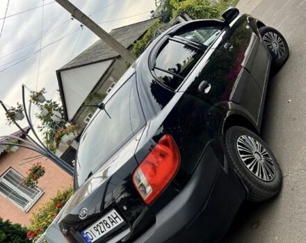 Черный Киа Рио, объемом двигателя 1.4 л и пробегом 252 тыс. км за 3889 $, фото 1 на Automoto.ua