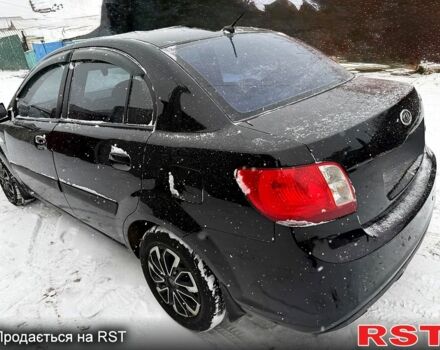 Чорний Кіа Ріо, об'ємом двигуна 1.4 л та пробігом 167 тис. км за 5550 $, фото 4 на Automoto.ua