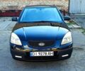 Черный Киа Рио, объемом двигателя 1.4 л и пробегом 260 тыс. км за 3100 $, фото 1 на Automoto.ua