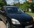 Черный Киа Рио, объемом двигателя 1.4 л и пробегом 256 тыс. км за 2900 $, фото 1 на Automoto.ua