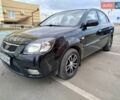 Черный Киа Рио, объемом двигателя 1.5 л и пробегом 155 тыс. км за 5650 $, фото 1 на Automoto.ua