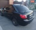 Чорний Кіа Ріо, об'ємом двигуна 1.4 л та пробігом 210 тис. км за 4700 $, фото 3 на Automoto.ua