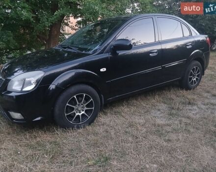 Чорний Кіа Ріо, об'ємом двигуна 1.4 л та пробігом 210 тис. км за 4700 $, фото 1 на Automoto.ua