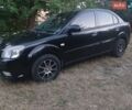 Чорний Кіа Ріо, об'ємом двигуна 1.4 л та пробігом 210 тис. км за 4700 $, фото 1 на Automoto.ua