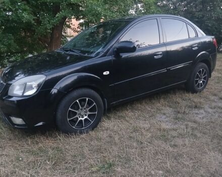 Черный Киа Рио, объемом двигателя 1.4 л и пробегом 210 тыс. км за 4009 $, фото 1 на Automoto.ua
