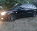 Черный Киа Рио, объемом двигателя 1.4 л и пробегом 210 тыс. км за 4009 $, фото 1 на Automoto.ua