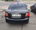 Черный Киа Рио, объемом двигателя 1.4 л и пробегом 180 тыс. км за 5950 $, фото 3 на Automoto.ua