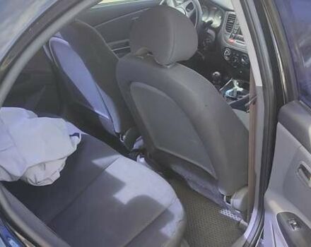 Черный Киа Рио, объемом двигателя 1.4 л и пробегом 224 тыс. км за 4600 $, фото 2 на Automoto.ua