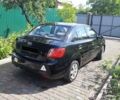Чорний Кіа Ріо, об'ємом двигуна 1.4 л та пробігом 140 тис. км за 5200 $, фото 1 на Automoto.ua