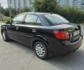 Чорний Кіа Ріо, об'ємом двигуна 1.4 л та пробігом 244 тис. км за 4718 $, фото 3 на Automoto.ua