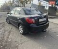 Чорний Кіа Ріо, об'ємом двигуна 1.4 л та пробігом 105 тис. км за 4400 $, фото 2 на Automoto.ua