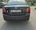 Чорний Кіа Ріо, об'ємом двигуна 1.4 л та пробігом 244 тис. км за 4718 $, фото 4 на Automoto.ua