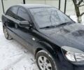 Черный Киа Рио, объемом двигателя 1.4 л и пробегом 100 тыс. км за 5800 $, фото 1 на Automoto.ua