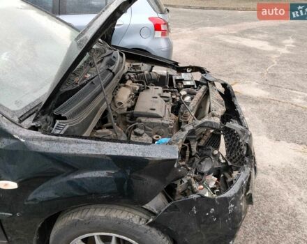 Чорний Кіа Ріо, об'ємом двигуна 1.4 л та пробігом 160 тис. км за 2600 $, фото 4 на Automoto.ua