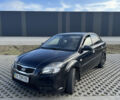 Черный Киа Рио, объемом двигателя 1.4 л и пробегом 208 тыс. км за 3900 $, фото 1 на Automoto.ua