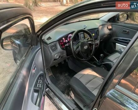 Чорний Кіа Ріо, об'ємом двигуна 1.4 л та пробігом 275 тис. км за 4700 $, фото 8 на Automoto.ua