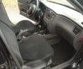 Черный Киа Рио, объемом двигателя 1.4 л и пробегом 220 тыс. км за 6500 $, фото 1 на Automoto.ua