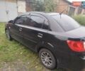 Черный Киа Рио, объемом двигателя 1.4 л и пробегом 133 тыс. км за 5900 $, фото 2 на Automoto.ua