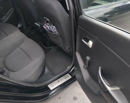 Чорний Кіа Ріо, об'ємом двигуна 1.4 л та пробігом 123 тис. км за 7600 $, фото 4 на Automoto.ua
