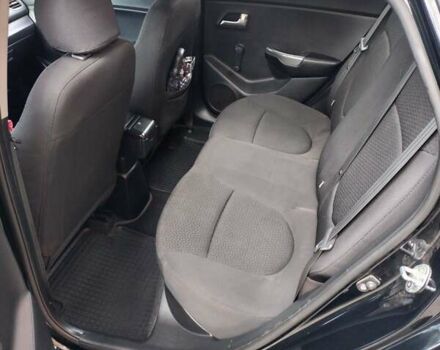 Чорний Кіа Ріо, об'ємом двигуна 1.4 л та пробігом 123 тис. км за 7600 $, фото 6 на Automoto.ua