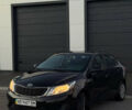 Чорний Кіа Ріо, об'ємом двигуна 1.4 л та пробігом 136 тис. км за 6900 $, фото 2 на Automoto.ua
