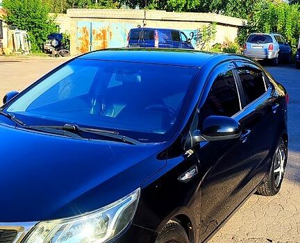Черный Киа Рио, объемом двигателя 1.4 л и пробегом 120 тыс. км за 7700 $, фото 4 на Automoto.ua