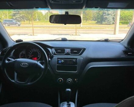 Чорний Кіа Ріо, об'ємом двигуна 1.4 л та пробігом 102 тис. км за 7394 $, фото 1 на Automoto.ua