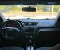 Чорний Кіа Ріо, об'ємом двигуна 1.4 л та пробігом 102 тис. км за 7394 $, фото 1 на Automoto.ua