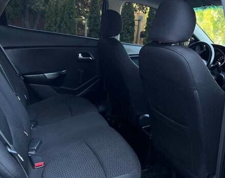Чорний Кіа Ріо, об'ємом двигуна 1.4 л та пробігом 100 тис. км за 7607 $, фото 7 на Automoto.ua