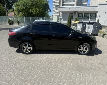 Черный Киа Рио, объемом двигателя 1.6 л и пробегом 330 тыс. км за 5500 $, фото 1 на Automoto.ua
