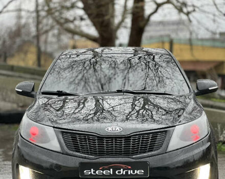 Черный Киа Рио, объемом двигателя 1.6 л и пробегом 231 тыс. км за 7999 $, фото 1 на Automoto.ua