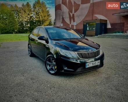 Чорний Кіа Ріо, об'ємом двигуна 1.4 л та пробігом 95 тис. км за 7300 $, фото 2 на Automoto.ua