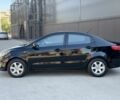 Чорний Кіа Ріо, об'ємом двигуна 1.4 л та пробігом 201 тис. км за 6948 $, фото 1 на Automoto.ua