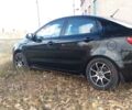 Чорний Кіа Ріо, об'ємом двигуна 1.4 л та пробігом 77 тис. км за 9200 $, фото 4 на Automoto.ua