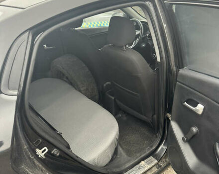 Чорний Кіа Ріо, об'ємом двигуна 1.4 л та пробігом 100 тис. км за 3500 $, фото 4 на Automoto.ua