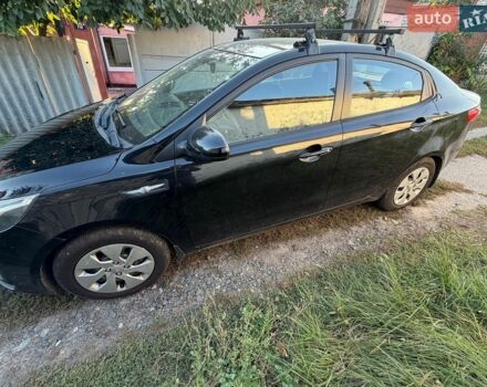 Чорний Кіа Ріо, об'ємом двигуна 1.4 л та пробігом 73 тис. км за 8900 $, фото 3 на Automoto.ua