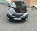 Чорний Кіа Ріо, об'ємом двигуна 1.4 л та пробігом 123 тис. км за 7600 $, фото 1 на Automoto.ua
